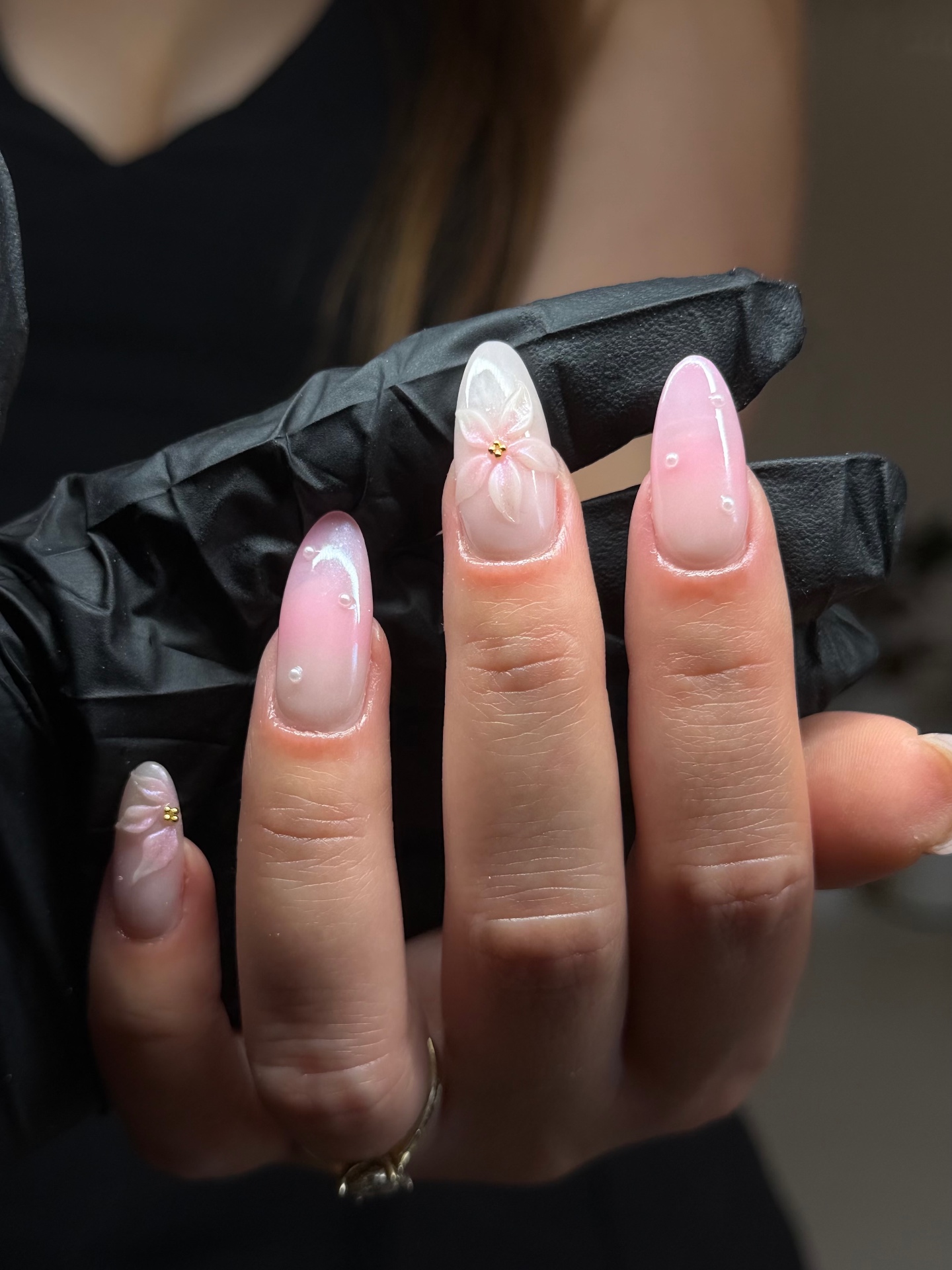 Almond nails with pink ombré and hand-painted floral detail